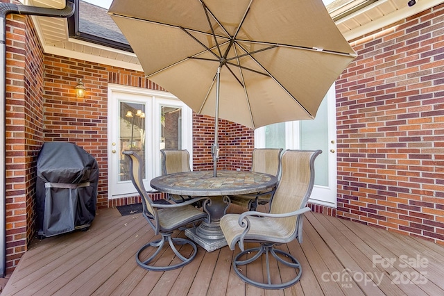 wooden deck featuring grilling area