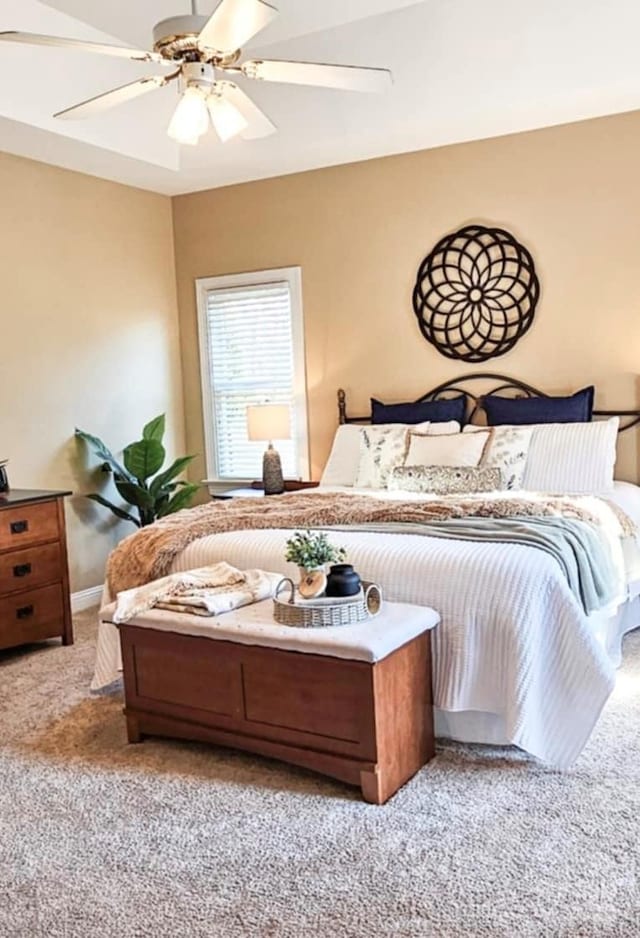 carpeted bedroom with ceiling fan