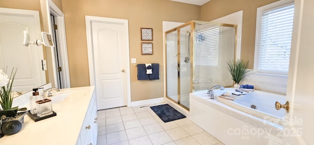 bathroom featuring tile patterned floors, vanity, separate shower and tub, and a wealth of natural light