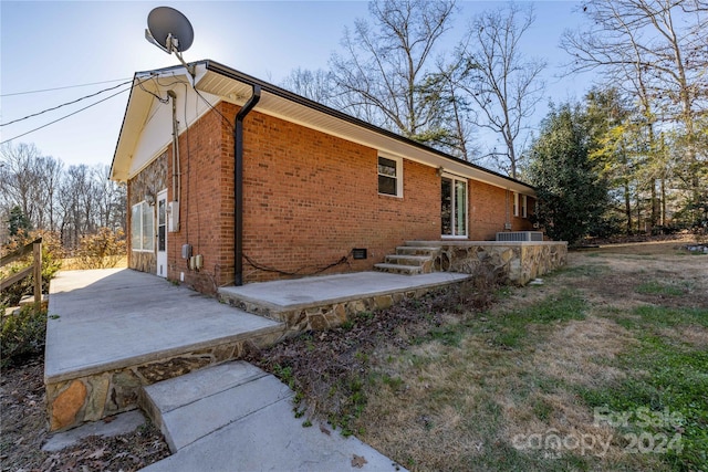 view of home's exterior with a patio