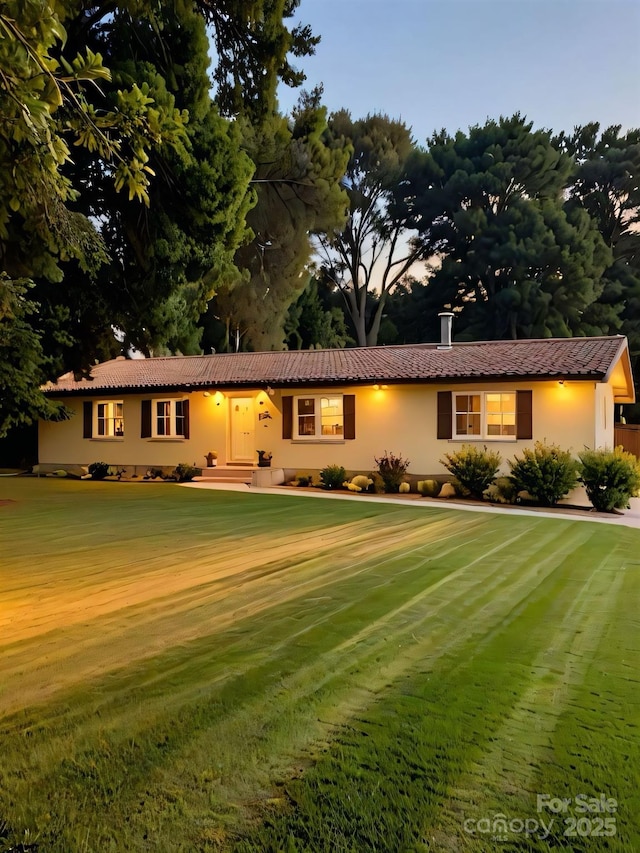 206 Fox Den Rd, Troy, NC 27371 - ranch-style house featuring stucco siding and a tiled roof