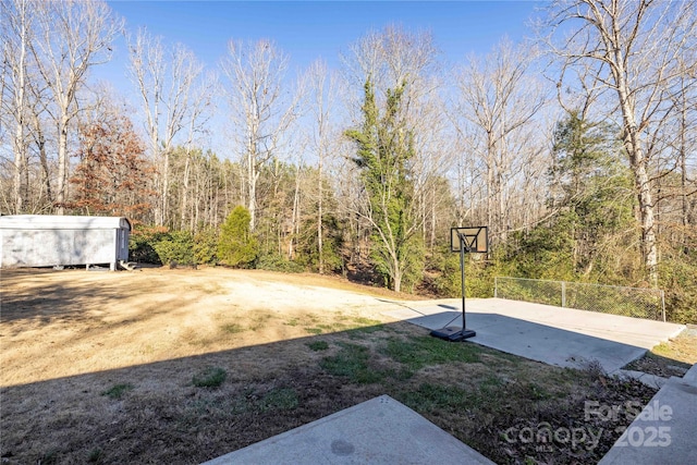 206 Fox Den Rd, Troy, NC 27371 - view of yard with a forest view and basketball hoop
