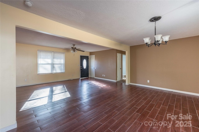 206 Fox Den Rd, Troy, NC 27371 - empty room featuring a smoke detector, a chandelier, dark wood finished floors, a ceiling fan, and a textured ceiling