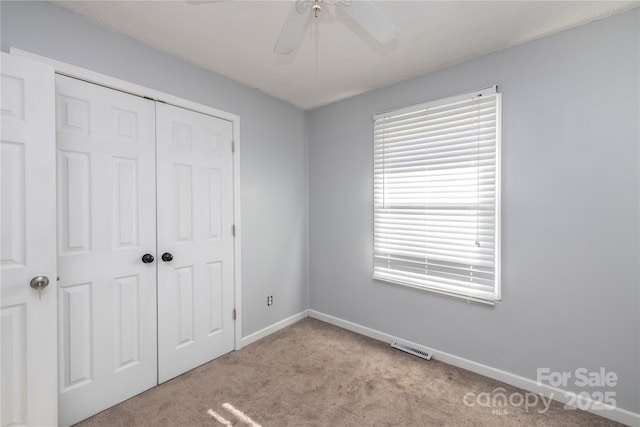 206 Fox Den Rd, Troy, NC 27371 - unfurnished bedroom featuring a closet, carpet floors, and ceiling fan