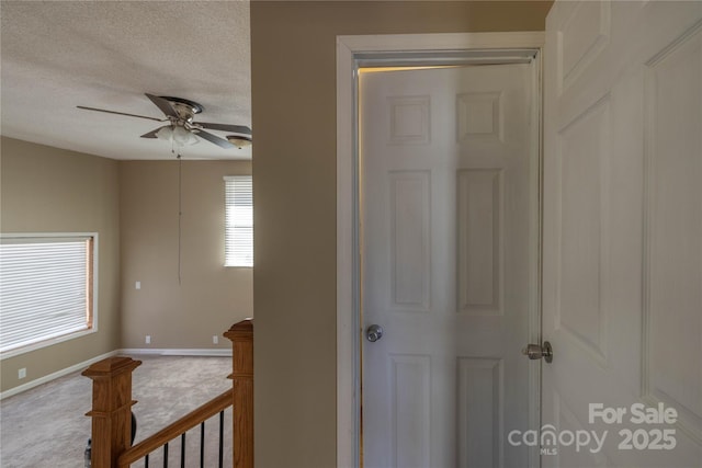 206 Fox Den Rd, Troy, NC 27371 - hall featuring a textured ceiling and carpet flooring