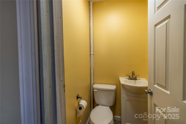 206 Fox Den Rd, Troy, NC 27371 - half bath featuring vanity and toilet