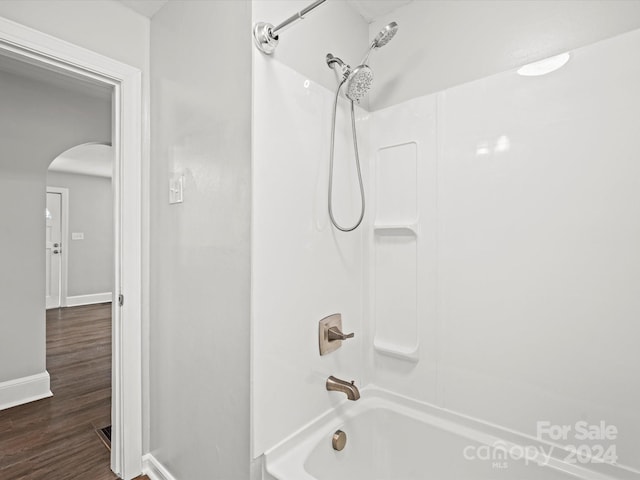 bathroom featuring hardwood / wood-style floors and tub / shower combination