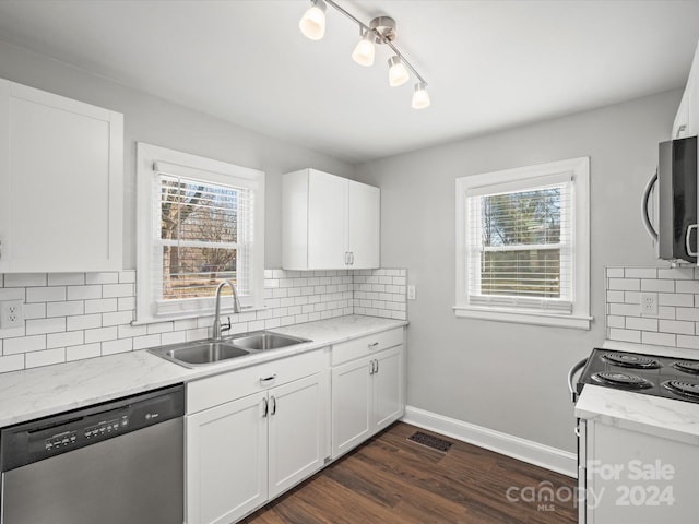 kitchen featuring dark wood-type flooring, sink, light stone countertops, white cabinetry, and stainless steel appliances