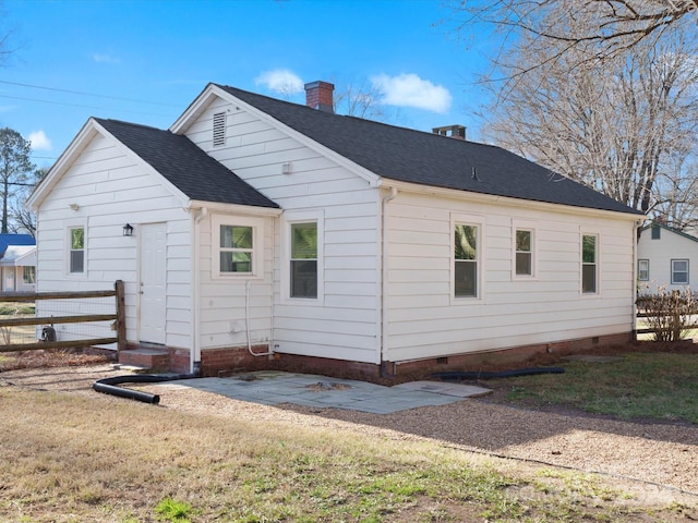 back of property featuring a lawn