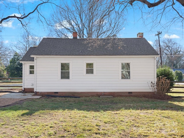 view of property exterior with a lawn