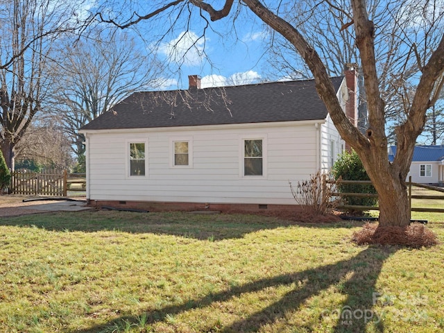 view of property exterior featuring a lawn