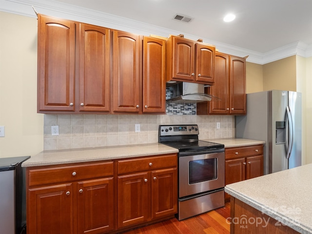 9903 Southampton Commons Dr, Charlotte, NC 28277 - kitchen featuring appliances with stainless steel finishes, ventilation hood, light countertops, crown molding, and dark wood finished floors