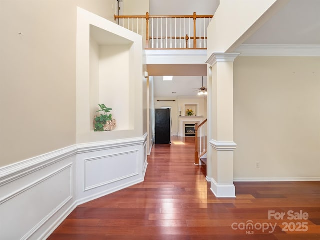 9903 Southampton Commons Dr, Charlotte, NC 28277 - corridor featuring wood finished floors, stairs, ornamental molding, and ornate columns