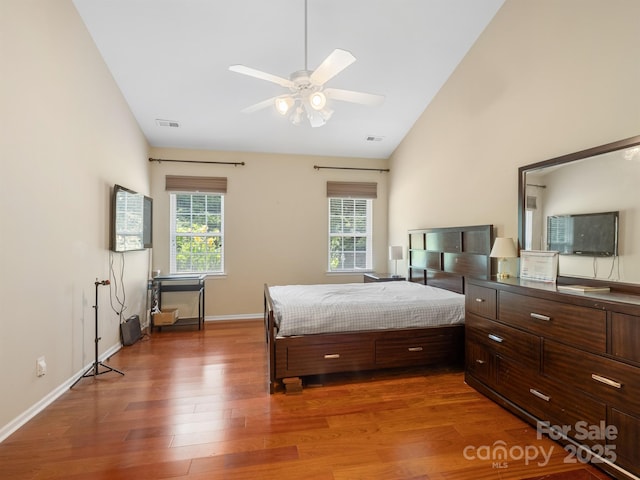 9903 Southampton Commons Dr, Charlotte, NC 28277 - bedroom with wood finished floors, vaulted ceiling, and a ceiling fan