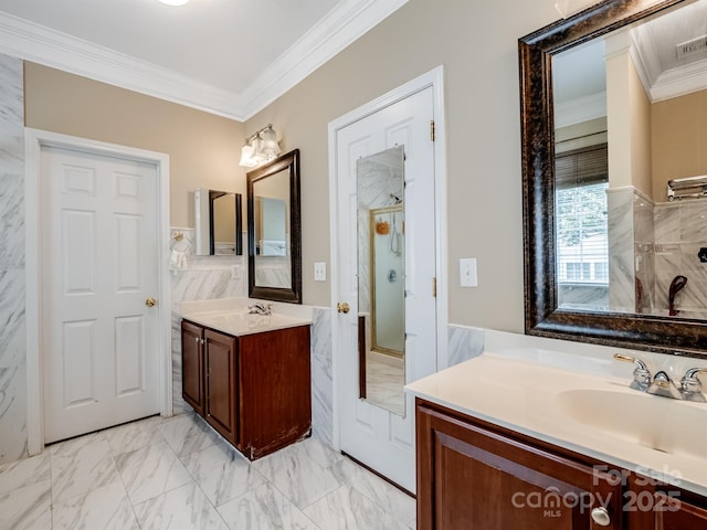 9903 Southampton Commons Dr, Charlotte, NC 28277 - full bathroom featuring crown molding, a stall shower, two vanities, a wainscoted wall, and marble look tile flooring