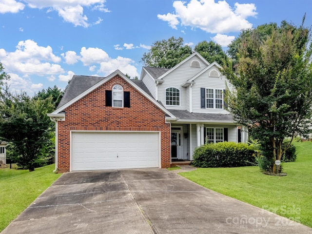9903 Southampton Commons Dr, Charlotte, NC 28277 - traditional home featuring concrete driveway, a front yard, brick siding, and a garage