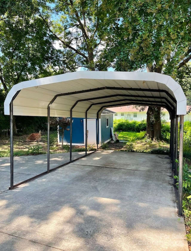 view of parking / parking lot with a carport