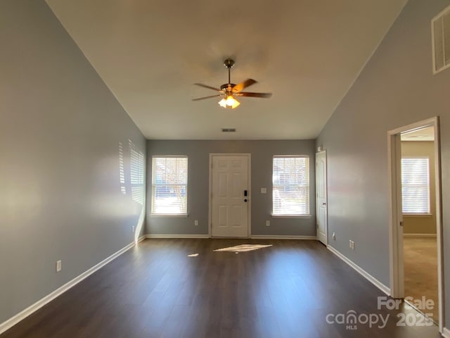 entrance foyer with dark hardwood / wood-style floors, plenty of natural light, ceiling fan, and lofted ceiling