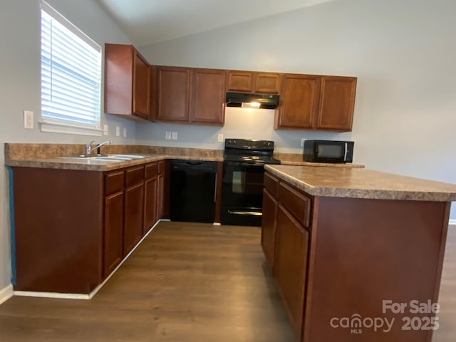 kitchen featuring sink, vaulted ceiling, dark wood-type flooring, and black appliances