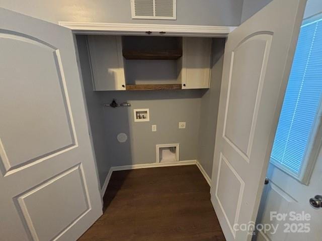 clothes washing area with dark hardwood / wood-style flooring and washer hookup