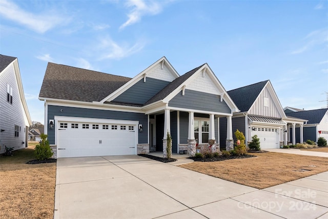 craftsman-style home featuring a porch and a garage