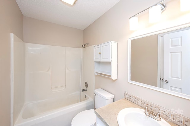 full bathroom featuring vanity, a textured ceiling, toilet, and shower / bathtub combination