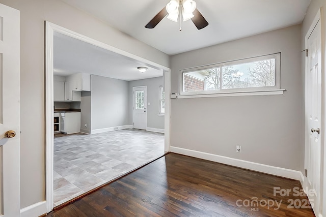 entrance foyer featuring light wood-type flooring and ceiling fan