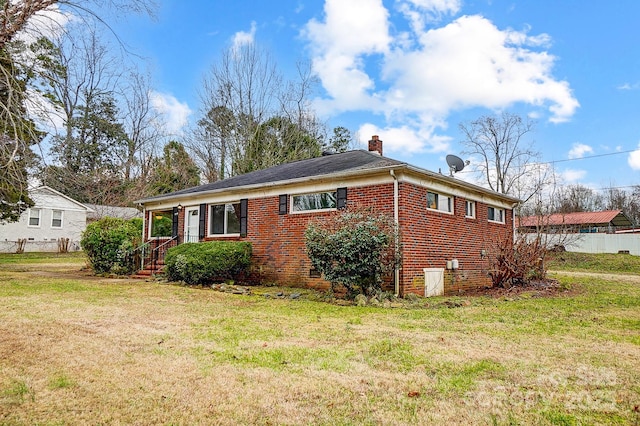 view of property exterior with a yard