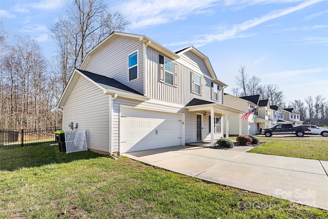 view of front of home with a garage and a front lawn