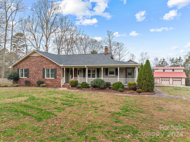 ranch-style home featuring a porch and a front yard