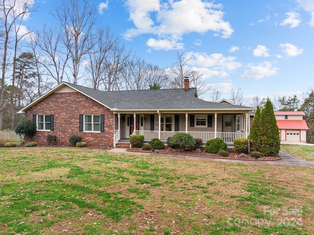 single story home featuring covered porch and a front lawn