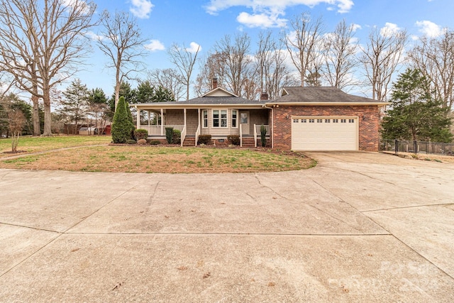 view of front of property featuring a garage, covered porch, and a front lawn