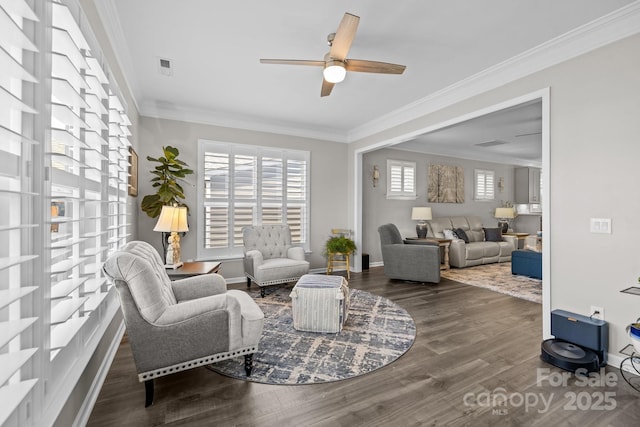 living room with ceiling fan, dark hardwood / wood-style flooring, and ornamental molding