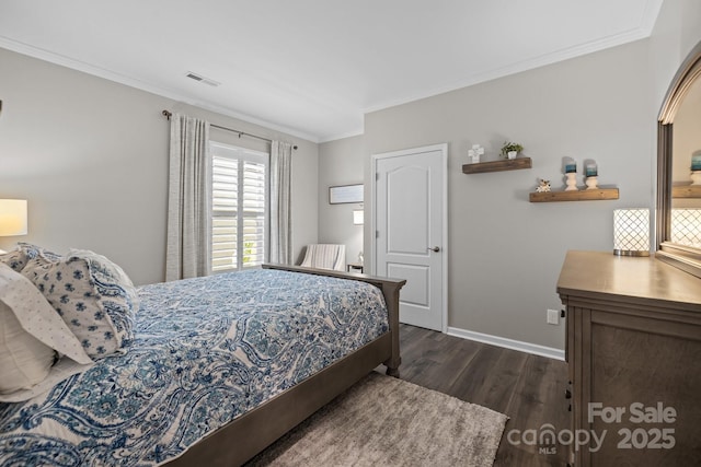 bedroom featuring dark hardwood / wood-style floors and ornamental molding