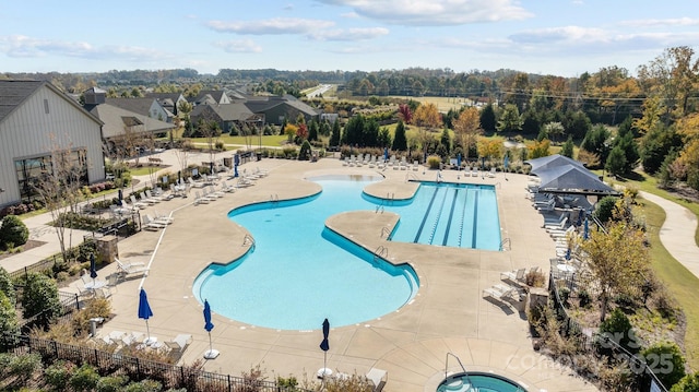 view of swimming pool with an in ground hot tub and a patio