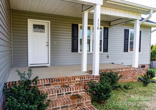 doorway to property with a porch