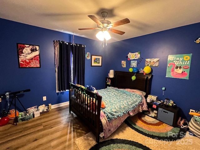 bedroom with hardwood / wood-style floors and ceiling fan