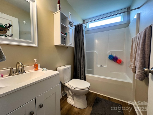 full bathroom featuring shower / tub combo, vanity, wood-type flooring, and toilet