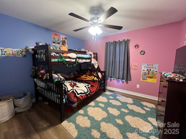 bedroom featuring hardwood / wood-style flooring and ceiling fan