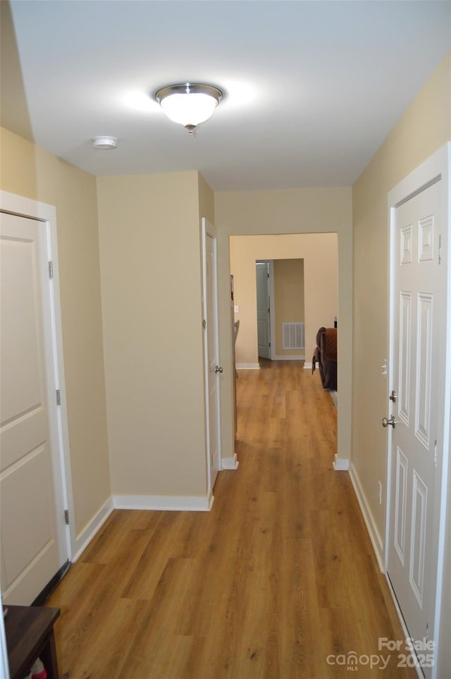 corridor featuring light hardwood / wood-style flooring