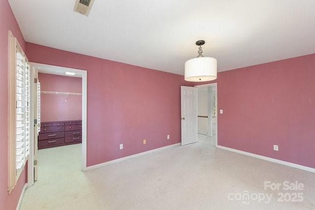 unfurnished bedroom with light carpet