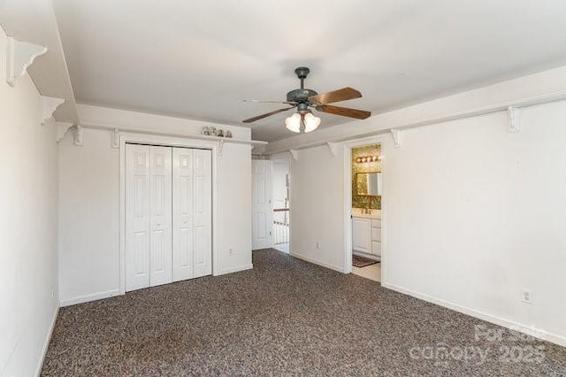 unfurnished bedroom with carpet floors, a closet, ensuite bath, and ceiling fan