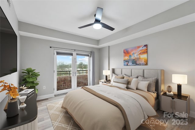 bedroom with french doors, access to outside, ceiling fan, and light hardwood / wood-style flooring