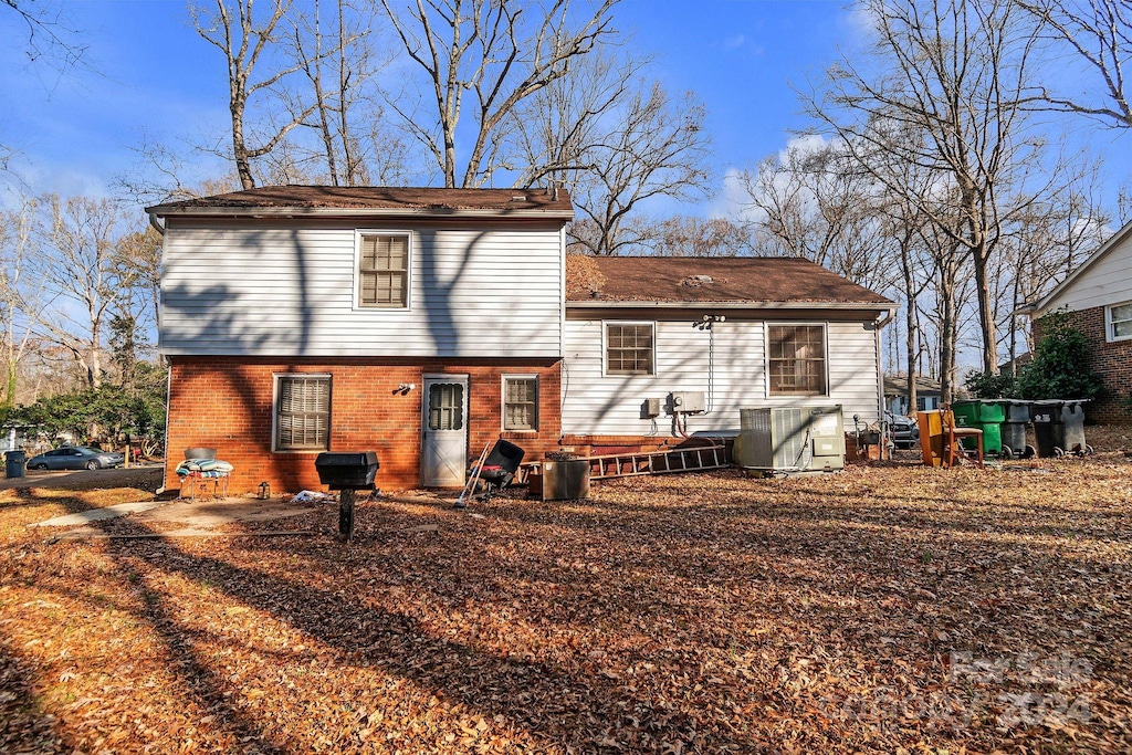 rear view of house with cooling unit