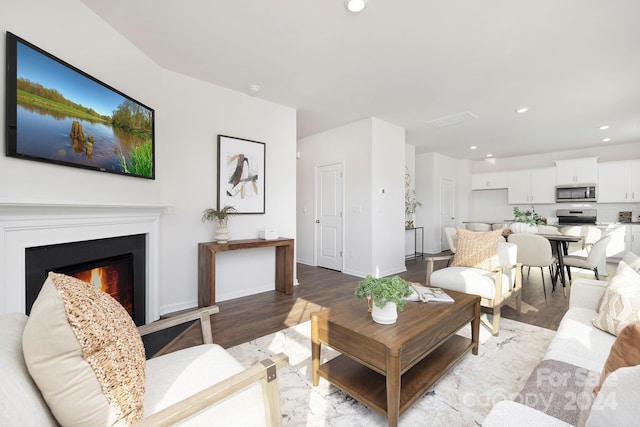 living room with light hardwood / wood-style flooring