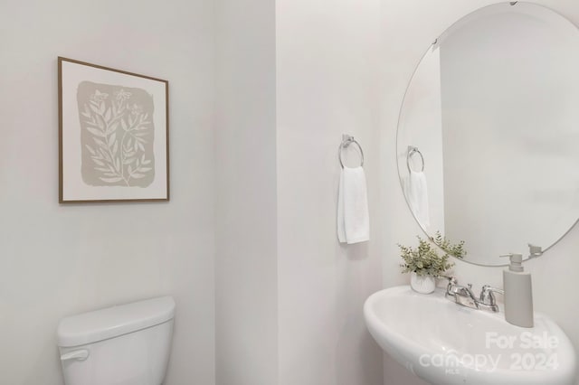 bathroom with toilet and sink