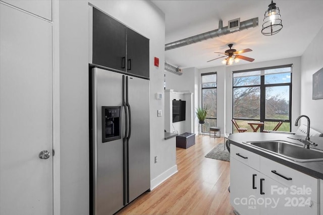 kitchen featuring white cabinetry, sink, ceiling fan, stainless steel refrigerator with ice dispenser, and light hardwood / wood-style floors