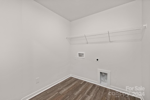 washroom featuring hookup for an electric dryer, dark hardwood / wood-style floors, and washer hookup