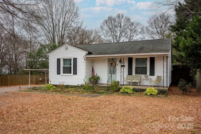 ranch-style home featuring a porch