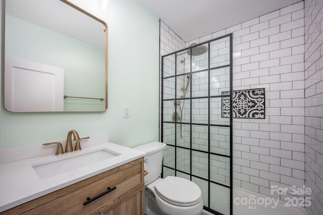 bathroom featuring vanity, toilet, and a tile shower